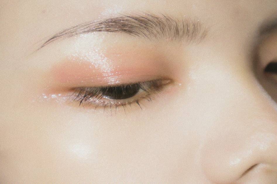 Close-up of soft glam prom eye makeup with shimmer accents