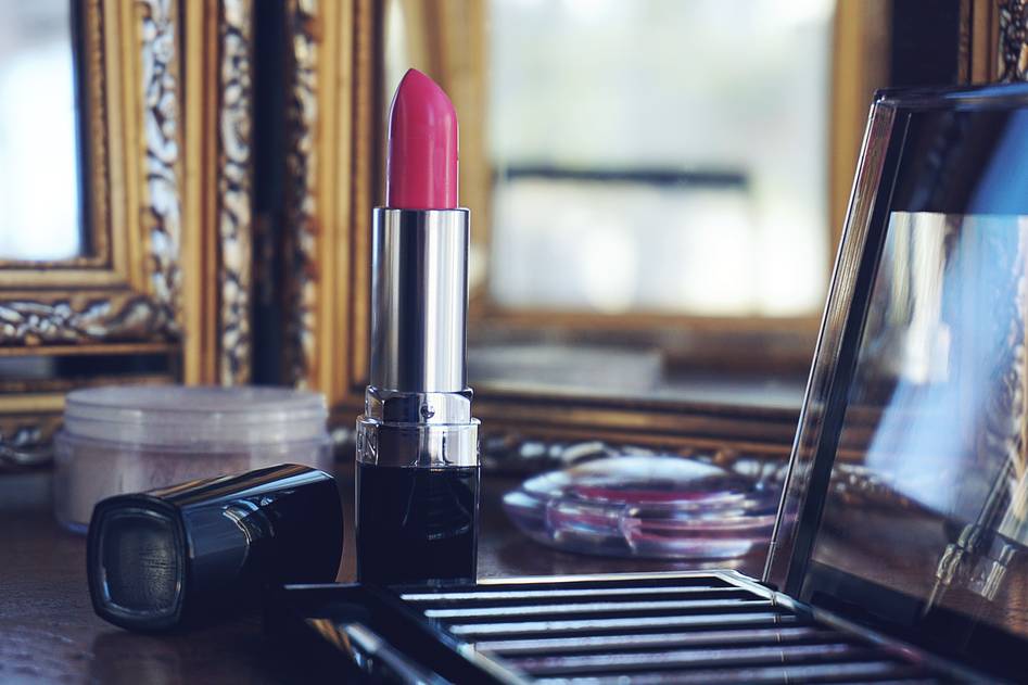 Elegant prom makeup with soft rose tones and glowing skin on a model
