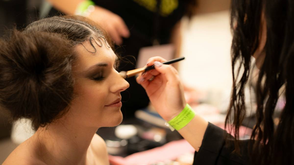 elegant evening palette displayed open with neutral and shimmer shadows arranged neatly for prom makeup